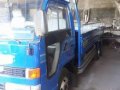 Isuzu Elf Dropside-9