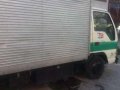 Isuzu Elf NKR Giga 4HF1 6W 14ft aluminum closevan.-3