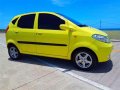 Yellow car Chana Benni 2008 model year. 1.3 L gas. Manual. Local.-1