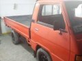 Well maintained Mitsubishi L300 Dropside Gas 1998 RED color for sale-2