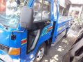 Isuzu Elf Dropside-2