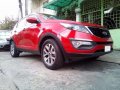 KIA 2015 acq.sportage. red matic .-1