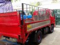 Isuzu Elf Dropside stainless with POWER LIFTER 10 ft. Single tire GIGA-8