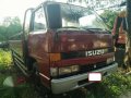 isuzu elf dropside 4be1 inline nkr 14ft Truck-1