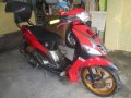 MAZDA 323 familia and YAMAHA Mio motorcycle-1