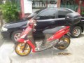 MAZDA 323 familia and YAMAHA Mio motorcycle-0