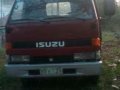 Isuzu Elf Dropside 1999 Red MT For Sale-0