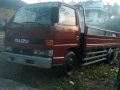 Isuzu Elf Dropside 1999 Red MT For Sale-1