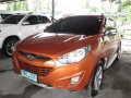 2013 Hyundai Tucson orange SUV gasoline for sale -0