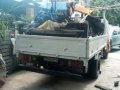 Isuzu Elf Boom truck drop side-9