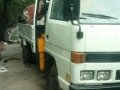 Isuzu Elf Boom truck drop side-1