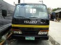 Isuzu elf dropside giga 14ft Nkr 6wheeler no truckban new tires-0