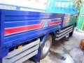 Isuzu Elf Dropside GIGA WIDE-5