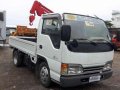 surplus japan isuzu elf dropside with mini crane-0
