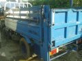 Isuzu elf NKR dropside with lifter for sale -1