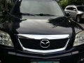 2009 Mazda Tribute 4x2 SUV AT Black For Sale-1