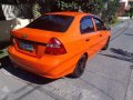 Chevrolet Aveo Sedan 2010 Orange For Sale -0