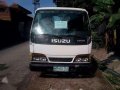 Isuzu NHR Dropside truck for sale -0