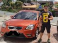 Kia Rio 2010 1.4 AT Sunset Orange-0