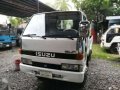 isuzu elf 4WD dropside cargo-6
