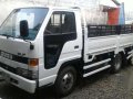 Isuzu Elf Dropside 11.5ft MT White For Sale -0