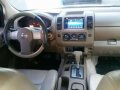 2011 Nissan Frontier Navarra LE 4x4 AT Silver For Sale -0
