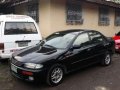 Mazda Rayband 1997 MT Black Sedan For Sale -0