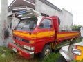 Isuzu Elf 4BC1 14ft Dropside Red Truck For Sale -0
