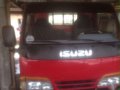 Isuzu Elf Dropside 12ft MT Red Truck For Sale -0