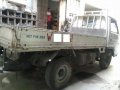 Isuzu Elf NKR Dropside 4W 4BE1 Rotary White For Sale -4