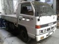 Isuzu Elf NKR Dropside 4W 4BE1 Rotary White For Sale -1