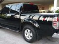 2009 Nissan Navara 4x4 AT Pick-up Black For Sale -0