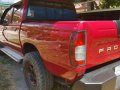 Nissan Frontier 2005 Red Pickup For Sale -0