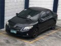 Toyota Corolla Altis 1.6V 2010 AT Black For Sale -0