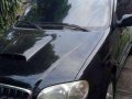 kia grand carnival 2002 blackvan for sale -5