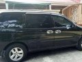 kia grand carnival 2002 blackvan for sale -1