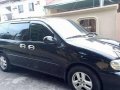 kia grand carnival 2002 blackvan for sale -6