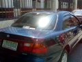 Mazda Familia car 4 door 1997-1