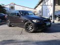 2009 BMW 318i M/T Black 4 door-0