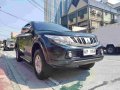 Selling Black Mitsubishi Strada 2016 Manual Diesel at 35000 km in Quezon City-0