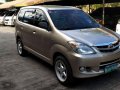 Selling Gold Toyota Avanza 2009 at 89,882 km in Cainta-6