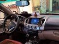 Red Mitsubishi Strada 2012 Automatic Diesel for sale -4