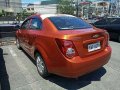 Orange Chevrolet Sonic 2015 at 30303 km for sale -0