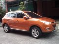 Orange Hyundai Tucson 2013 at 40000 km for sale -4