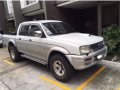 White Mitsubishi Strada 2001 for sale in Quezon City-2