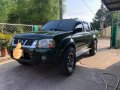 Green Nissan Frontier 2004 at 100000 km for sale -1