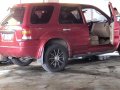 Red Ford Escape 2005 at 124000 km for sale in Cavite -0