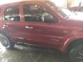 Red Ford Escape 2005 at 124000 km for sale in Cavite -1