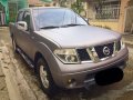 Silver Nissan Frontier Navara 2013 at 97000 km for sale-3