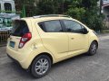 Yellow Chevrolet Spark 2013 Hatchback for sale in Manila -2